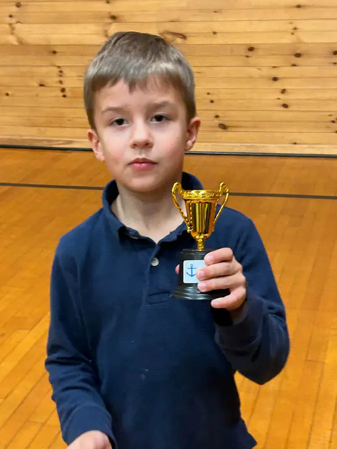 Little boy holding a small trophy